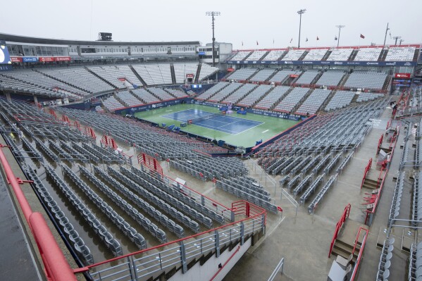 Stands sit empty as rain forced the cancelation of matches at the men's National Bank Open tennis tournament in Montreal, Friday, Aug. 9, 2024. (Ryan Remiorz/The Canadian Press via AP)