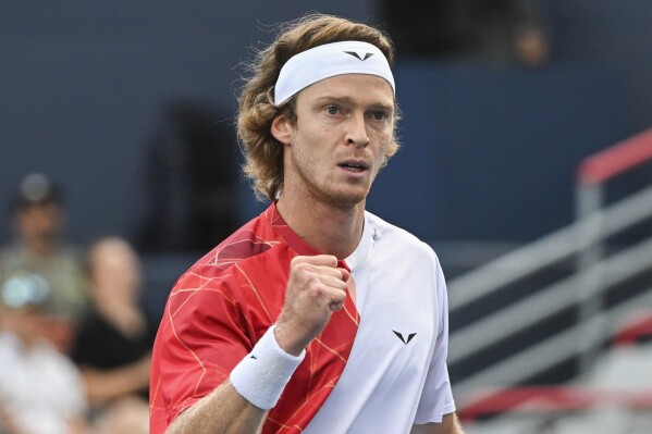 Andrey Rublev, of Russia, reacts to a shot to Matteo Arnaldi, of Italy, during their semifinal match at the National Bank Open tennis tournament in Montreal, Sunday, Aug. 11, 2024. (Graham Hughes/The Canadian Press via AP)