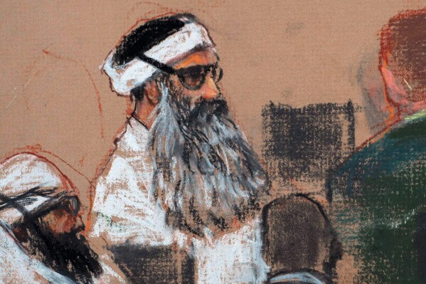 This Monday, Dec. 8, 2008 courtroom drawing by artist Janet Hamlin and reviewed by the U.S. military, shows Khalid Sheikh Mohammed, center, and co-defendant Walid Bin Attash, left, attending a pre-trial session at Guantanamo Bay Naval Base, Cuba. (AP Photo/Janet Hamlin, Pool, File)