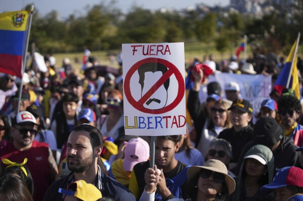 Venezuelan nationals protest against the results of their country's presidential election, in Quito, Ecuador, Saturday, Aug. 3, 2024. (AP Photo/Carlos Noriega)