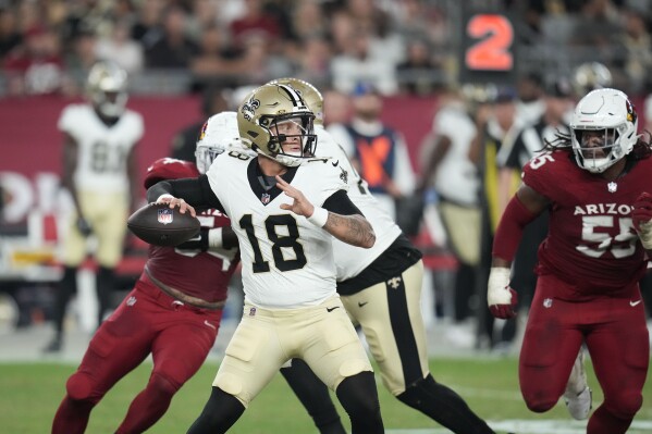 New Orleans Saints quarterback Spencer Rattler (18) passes in the second half of a preseason NFL football game against the Arizona Cardinals, Saturday, Aug. 10, 2024, in Glendale, Ariz. The Saints won 16-14. (AP Photo/Ross D. Franklin)