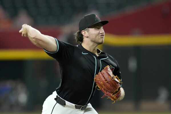 Arizona Diamondbacks pitcher Brandon Pfaadt throws against the Colorado Rockies during the first inning of a baseball game, Monday, Aug. 12, 2024, in Phoenix. (AP Photo/Ross D. Franklin)