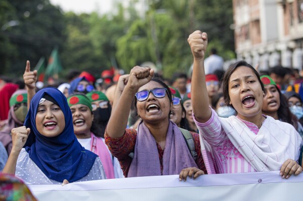 Students shout slogans during a protest demanding trial of former prime minister Sheikh Hasina, in Dhaka, Bangladesh, Tuesday, Aug. 13, 2024. (AP Photo/Rajib Dhar)