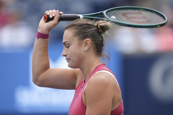 Aryna Sabalenka, of Belarus, reacts during her loss to Amanda Anisimova, of the United States, at the National Bank Open tennis tournament in Toronto, Saturday, Aug. 10, 2024. (Chris Young/The Canadian Press via AP)