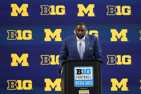 FILE - Michigan head coach Sherrone Moore speaks during an NCAA college football news conference at the Big Ten Conference media days at Lucas Oil Stadium, July 25, 2024, in Indianapolis. (AP Photo/Darron Cummings, File)