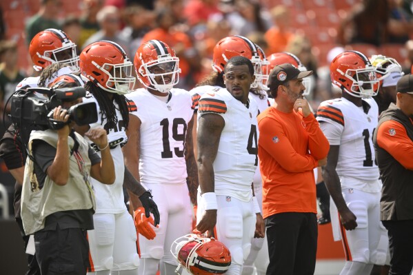 Cleveland Browns quarterback Deshaun Watson (4) stands next to head coach Kevin Stefanski during pregame of an NFL preseason football game against the Green Bay Packers, Saturday, Aug. 10, 2024, in Cleveland. (AP Photo/David Richard)