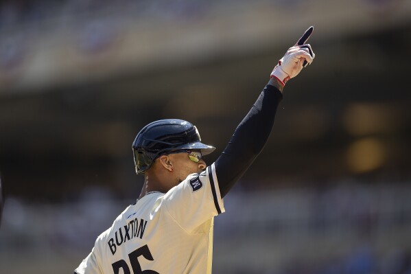 Minnesota Twins' Byron Buxton (25) celebrates his solo home run in the second inning of a baseball game against the Cleveland Guardians in Minneapolis, Minn., Sunday, Aug. 11, 2024. (Elizabeth Flores/Star Tribune via AP)