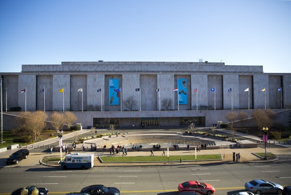 FILE - In this April 3, 2019, file photo people visit the Smithsonian Museum of American History on the National Mall in Washington. (AP Photo/Pablo Martinez Monsivais, File)