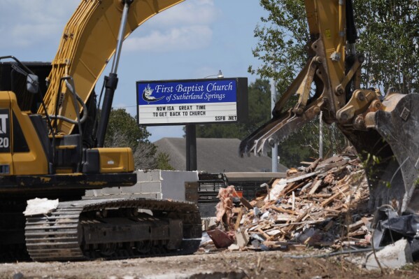 Workers continue demolition of the First Baptist Church where a gunman killed more than two dozen worshipers in 2017, in Sutherland Springs, Texas, Monday, Aug. 12, 2024. (AP Photo/Eric Gay)