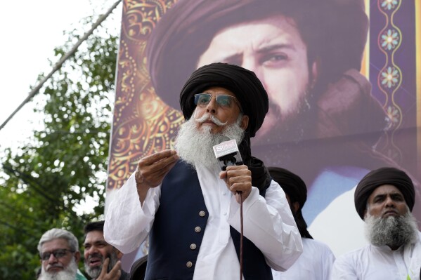 Zaheerul Hassan Shah, the deputy chief of a radical Islamist party, speaks to his supporters during a gathering in Lahore, Pakistan, Sunday, July 28, 2024. Pakistan's police on Monday, July 29, arrested Shah on the charge of ordering the killing of the chief justice over his alleged support to the minority Ahmadi community, officials said. AP Photo/K.M. Chaudary)