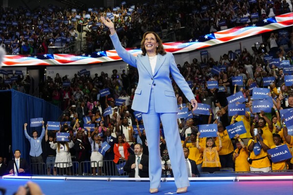 FILE - Vice President Kamala Harris waves during a campaign rally, July 30, 2024, in Atlanta. (AP Photo/John Bazemore, File)