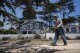 David Wilkinson walks along Scenic Road, Tuesday, July 23, 2024, in Carmel-By-The-Sea, Calif. (AP Photo/Godofredo A. Vásquez)