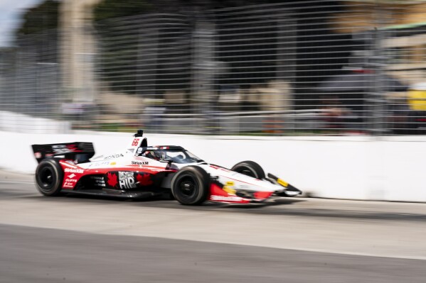 CORRECTS DRIVER'S NAME TO DAVID MALUKAS NOT TOM BLOMQVIST David Malukas (66) of the United States drives his car through turn 9 during the first practice ahead of the 2024 Ontario Dealers Honda Indy, in Toronto on Friday, July 19, 2024. (Arlyn McAdorey/The Canadian Press via AP)