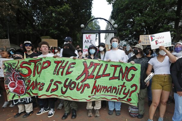 FILE - University of Georgia students march in front of the university arch in Athens, Ga., Friday, May 3, 2024, following the April 29, 2024, arrest of 16 students who tried to set up an encampment protesting the Israel-Hamas war. (Joshua L. Jones/Athens Banner-Herald via AP, File)/Athens Banner-Herald via AP, File)