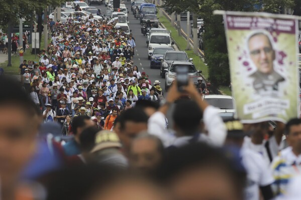 A religious procession honors Saint Oscar Arnulfo Romero in San Salvador, El Salvador, Thursday, Aug. 1, 2024. Romero was assassinated on March 24, 1980, while celebrating Mass. (AP Photo/Salvador Melendez)