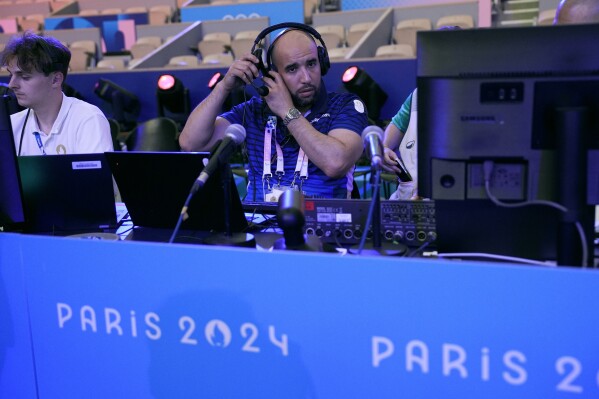 Nacer Eddine Zorgani prepares for the night's boxing matches at the 2024 Summer Olympics, Thursday, Aug. 8, 2024, in Paris, France. (AP Photo/John Locher)