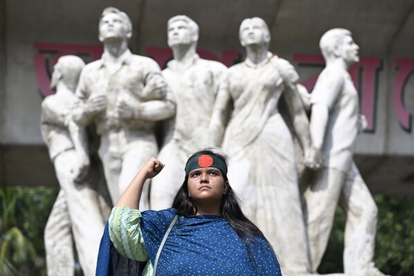 Nourin Sultana Toma, a student at Dhaka University, poses for a photograph on the university campus, in Dhaka, Bangladesh, Saturday, Aug. 10, 2024. (AP Photo/Fatima Tuj Johora)