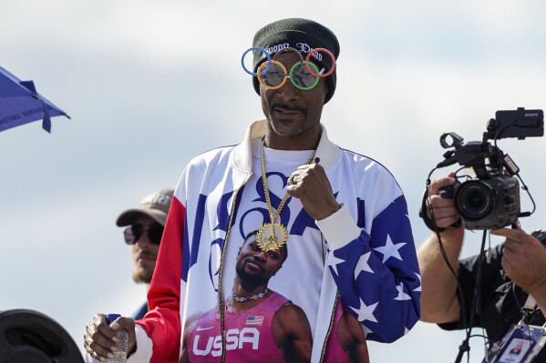 FILE - U.S. artist Snoop Dogg gestures during the men's skateboarding park finals at the 2024 Summer Olympics, on Aug. 7, 2024, in Paris, France. (AP Photo/Frank Franklin II, File)