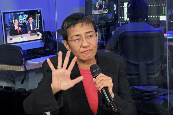 Maria Ressa, 2021 Nobel peace prize co-winner and founder of Rappler, an online news outfit, speaks to the media at the Rappler office in Manila, Philippines, Friday, Aug. 9, 2024. (AP Photo/Joeal Calupitan)