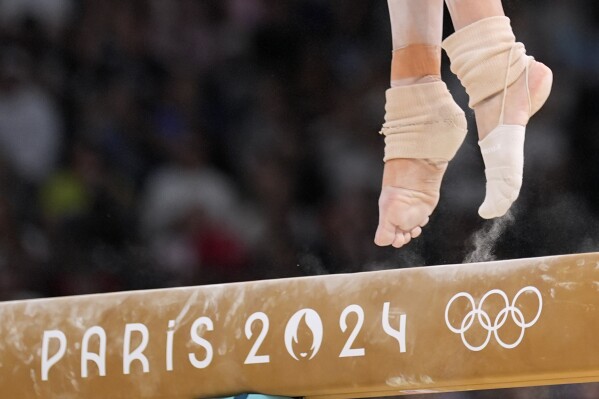 Georgia-Mae Fenton, of Great Britain, competes on the balance beam during a women's artistic gymnastics qualification round at the 2024 Summer Olympics, Sunday, July 28, 2024, in Paris, France. (AP Photo/Charlie Riedel)