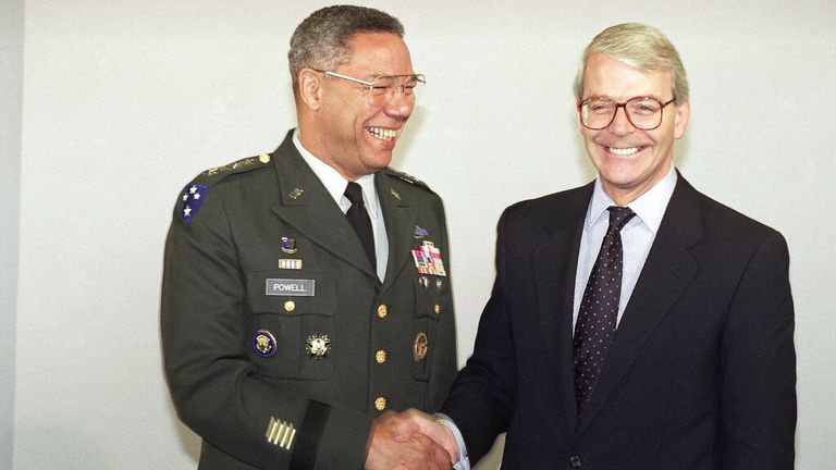 Former UK PM John Major (R) said he was 'proud' to call Colin Powell a friend