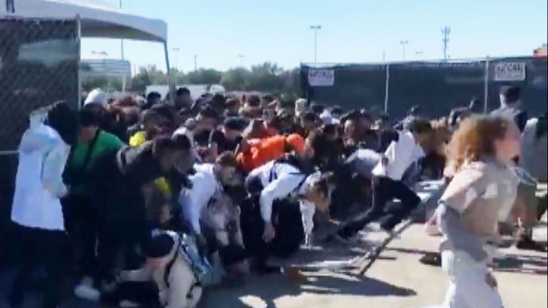 People crushed as crowds break through barriers at Travis Scott's Astroworld Festival earlier in the day.