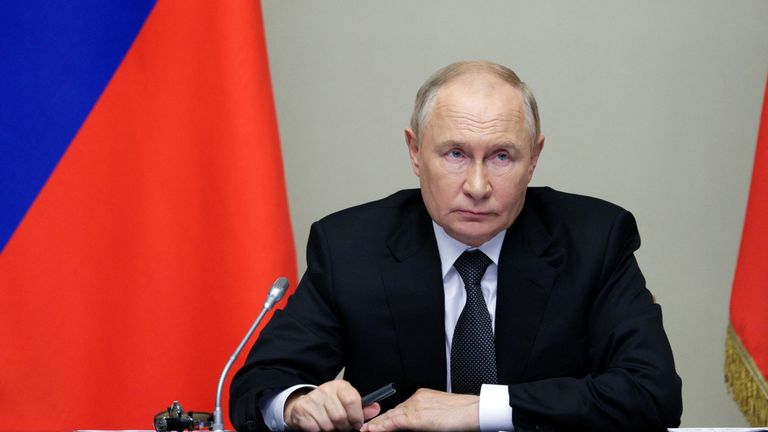 Vladimir Putin chairs a meeting with security officials and regional governors.
Pic: Sputnik/Reuters