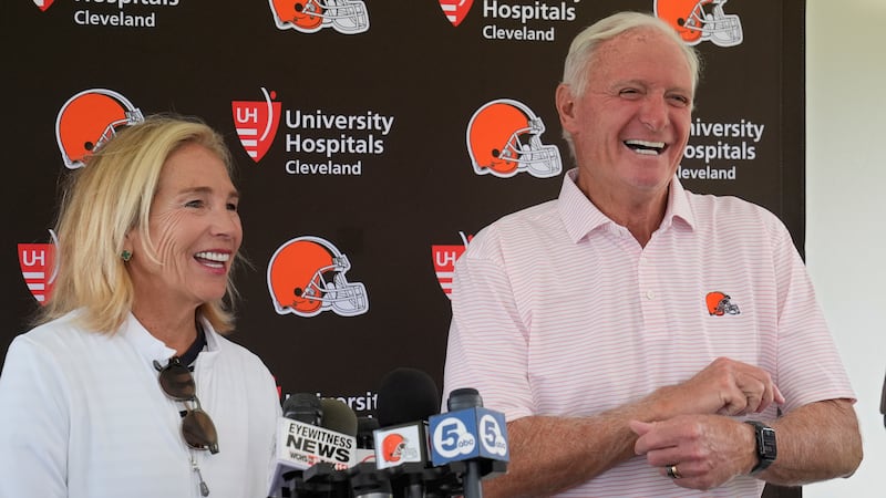 Cleveland Browns owners Dee and Jimmy Haslam laugh during a news conference at an NFL football...