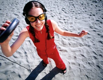 a person wearing sunglasses and holding a fishing pole