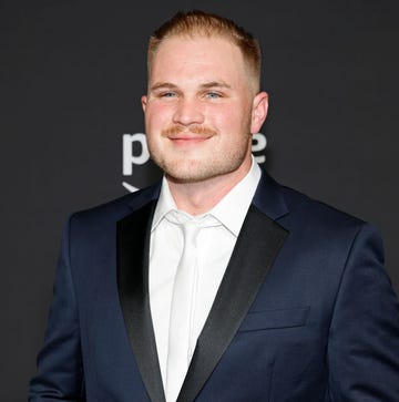 zach bryan stops for a photo at the academy of country music awards