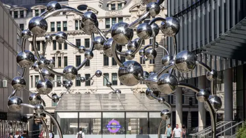  Gleaming silver spheres sculpture at Liverpool Street station