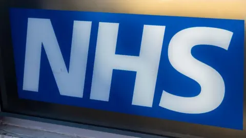 The NHS logo - the word written in a white font on a blue background