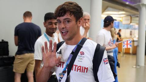 Tom Daley waving