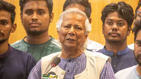 Muhammad Yunus surrounded by student leaders