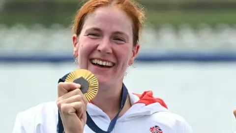 Georgie Brayshaw holds a gold medal