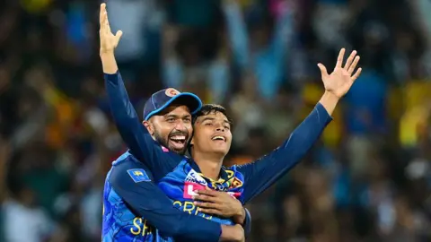 Sri Lanka's Dunith Wellalage (right) and Sadeera Samarawickrama (left) celebrate beating India