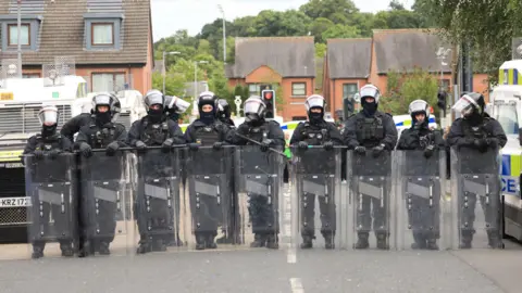 A line of PSNI officers in riot gear