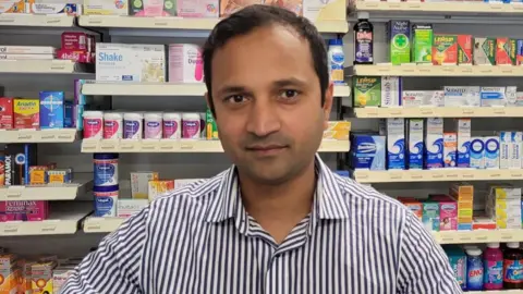 Ramesh Yadav a man in front of pharmacy shelves