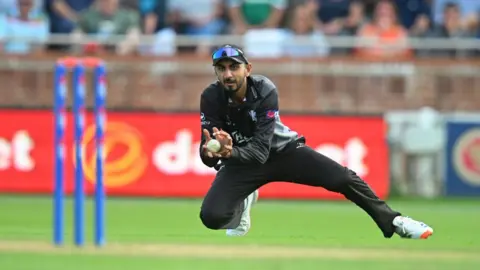 Shoaib Bashir of Somerset takes a catch during the Metro Bank One Day Cup