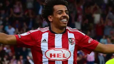 Caleb Watts celebrates scoring for Exeter City