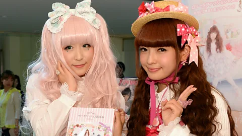 Coquette girls wearing bows and lace  (Getty Images)