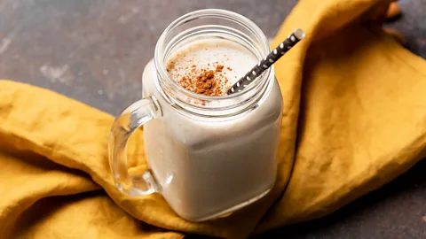 Milkshake with straw on yellow linen (Credit: Getty Images)