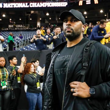 Michigan offensive coordinator Sherrone Moore arrives for the national championship game at NRG Stadium in Houston on Monday, Jan. 8, 2024.