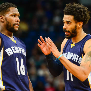 Feb 4, 2017; Minneapolis, MN, USA; Memphis Grizzlies guard Mike Conley (11) talks with guard Toney Douglas (16) during the fourth quarter against the Minnesota Timberwolves at Target Center. The Grizzlies won 107-99. 