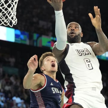 Aug 8, 2024; Paris, France; United States forward LeBron James (6) goes to the basket during the second half against Serbia in a men's basketball semifinal game during the Paris 2024 Olympic Summer Games at Accor Arena. Mandatory Credit: Kyle Terada-USA TODAY Sports