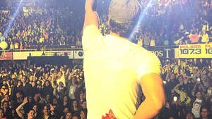 0531-enrique-iglesias-cut-hand-AP-01