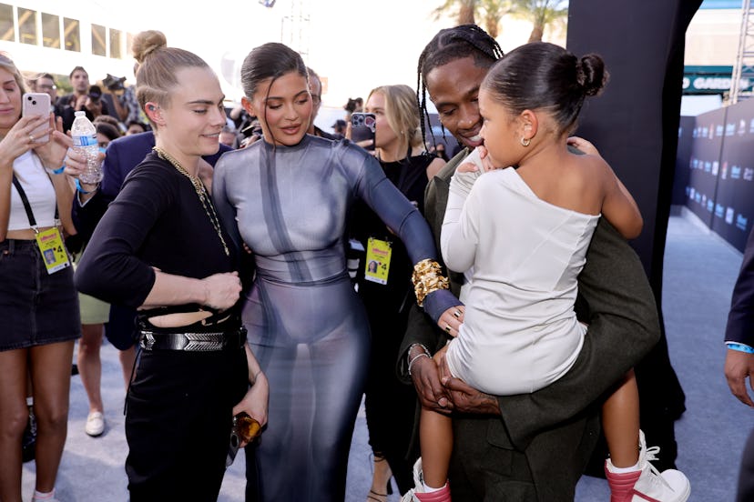 LAS VEGAS, NEVADA - MAY 15: (L-R) Cara Delevingne, Kylie Jenner, Travis Scott, and Stormi Webster at...