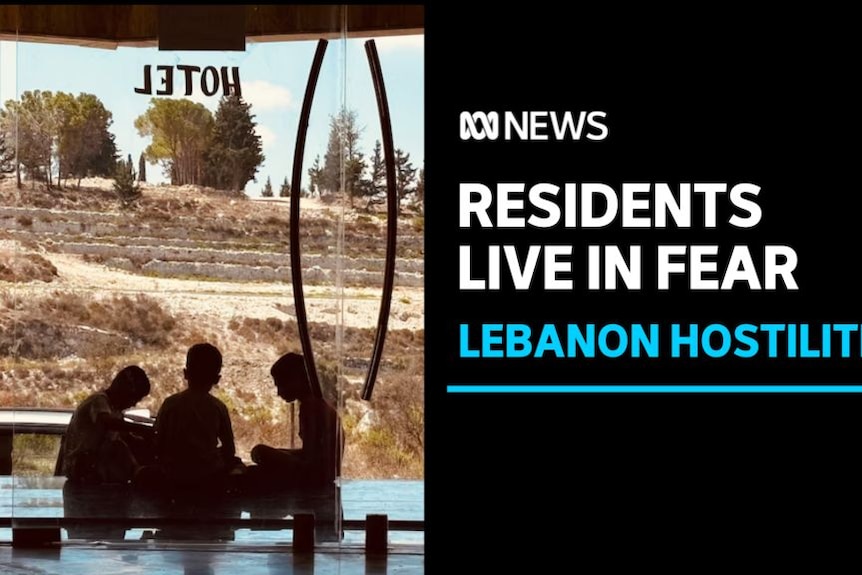 Residents Live in Fear, Lebanon Hostilities: View from inside building of three kids cross-legged, silhoueted against dry scene.