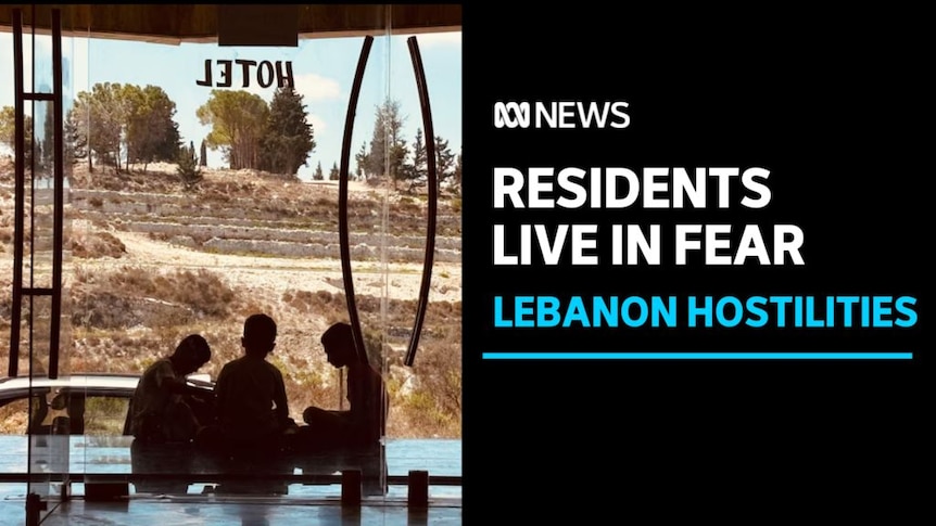 Residents Live in Fear, Lebanon Hostilities: View from inside building of three kids cross-legged, silhoueted against dry scene.