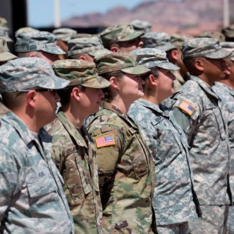 Members of the Arizona National Guard listen to instructions on April 9, 2018, at the Papago Park Military Reservation in Phoenix. - Arizona deployed its first 225 National Guard members to the Mexican border on Monday after President Donald Trump ordered thousands of troops to the frontier region to combat drug trafficking and illegal immigration.